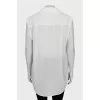 Silk blouse decorated with chain