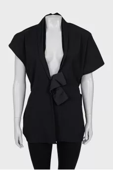 Vest decorated with a silk bow