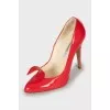 Red shoes with a figured cutout