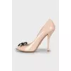 Patent leather shoes with a bow