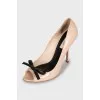 Patent leather shoes with a bow