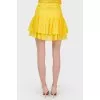 Mini-skirt with ruffles tag