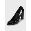 Black patent leather pointed toe shoes