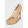 Leather high heels with gold trim