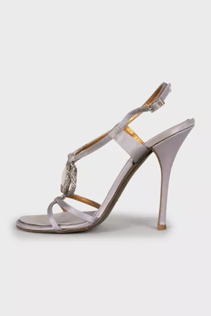 Sandals decorated with a snake