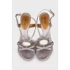 Sandals decorated with a snake