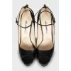 Leather shoes with buckles on the heel