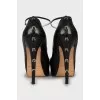 Leather shoes with buckles on the heel