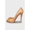 Gold colored open toe shoes