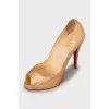 Gold colored open toe shoes