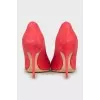Pink suede pumps