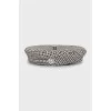 Beret in houndstooth print with tag