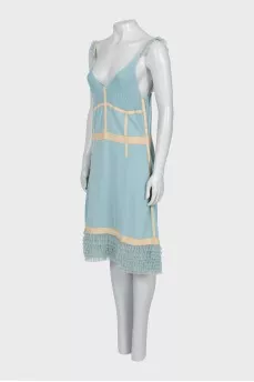 Dress with thin straps and frills