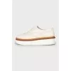 White leather brogues with perforations