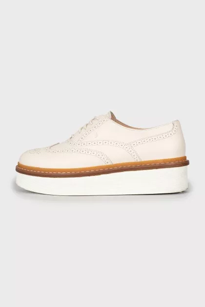 White leather brogues with perforations