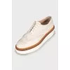 White leather brogues with perforations