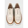 White leather brogues with perforations