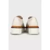 White leather brogues with perforations