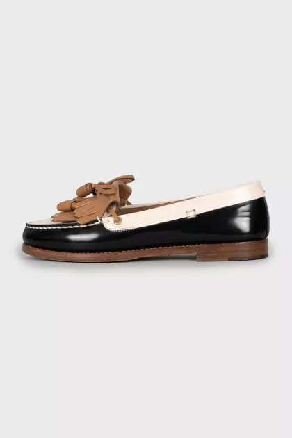 Black and white leather loafers