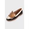 Black and white leather loafers