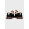 Black and white leather loafers