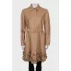 Leather trench coat decorated with flowers