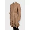 Leather trench coat decorated with flowers