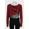 Top with logo decorated with rhinestones