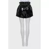 Patent leather shorts with belt