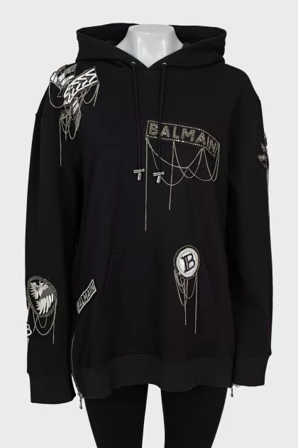 Black hoodie decorated with chains and rhinestones