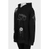 Black hoodie decorated with chains and rhinestones