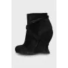 Suede ankle boots with a wedge heel and strap