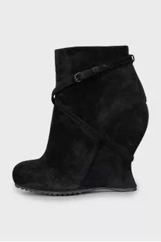 Suede ankle boots with a wedge heel and strap