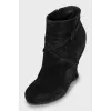 Suede ankle boots with a wedge heel and strap