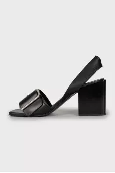 Leather sandals with a massive strap