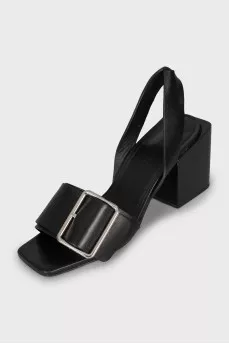 Leather sandals with a massive strap