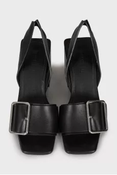 Leather sandals with a massive strap