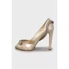 Golden shoes with rhinestones