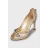 Golden shoes with rhinestones