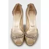 Golden shoes with rhinestones