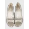 Open-toe shoes decorated with rhinestones