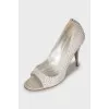 Open-toe shoes decorated with rhinestones