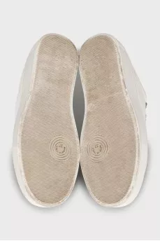 Leather sneakers decorated with rhinestones