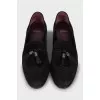 Suede loafers decorated with tassels