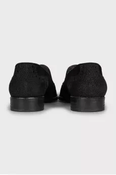 Suede loafers decorated with tassels