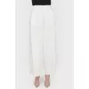 Free cut pants with buttons on the sides of the tag