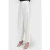 Free cut pants with buttons on the sides of the tag