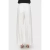 Free cut pants with buttons on the sides of the tag