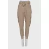 Brown trousers with patch pockets