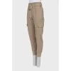 Brown trousers with patch pockets